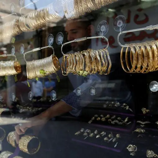 Gold ticks higher with focus on US inflation data